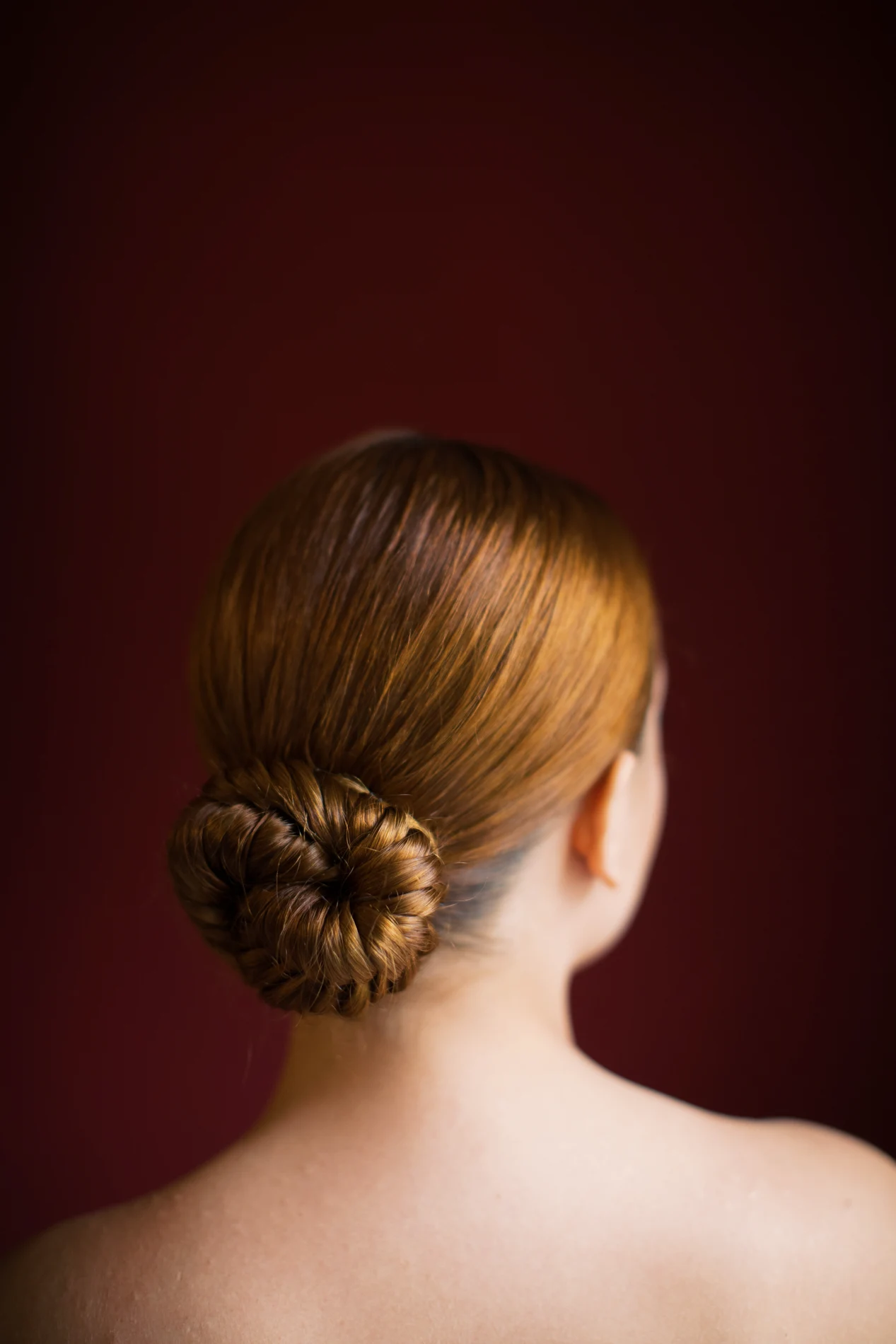 Low updo viewed in an editorial portrait.